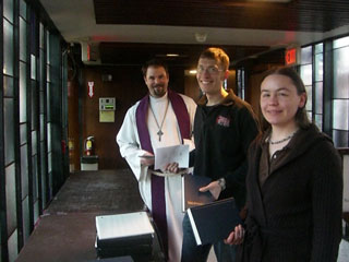 Amy presides at a home Eucharist