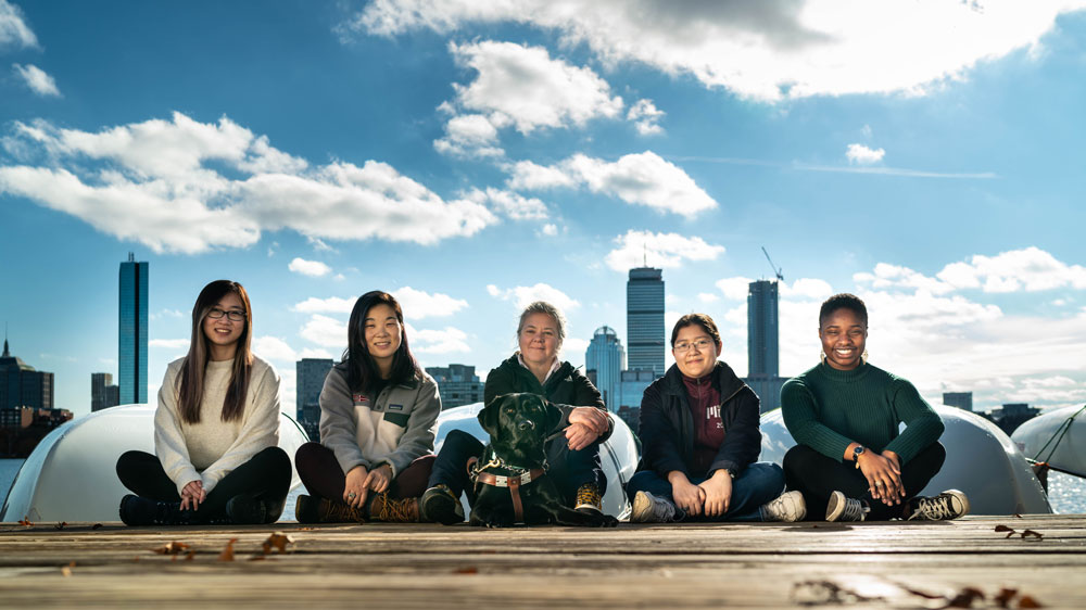 a photograph of the MIT team and the seeing-impaired boater who worked together on assistive technology