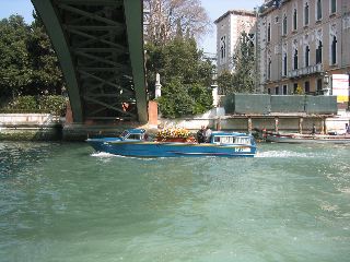 A Hearse-boat travels on the Grand Canal