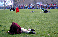Women rush to the fallen.