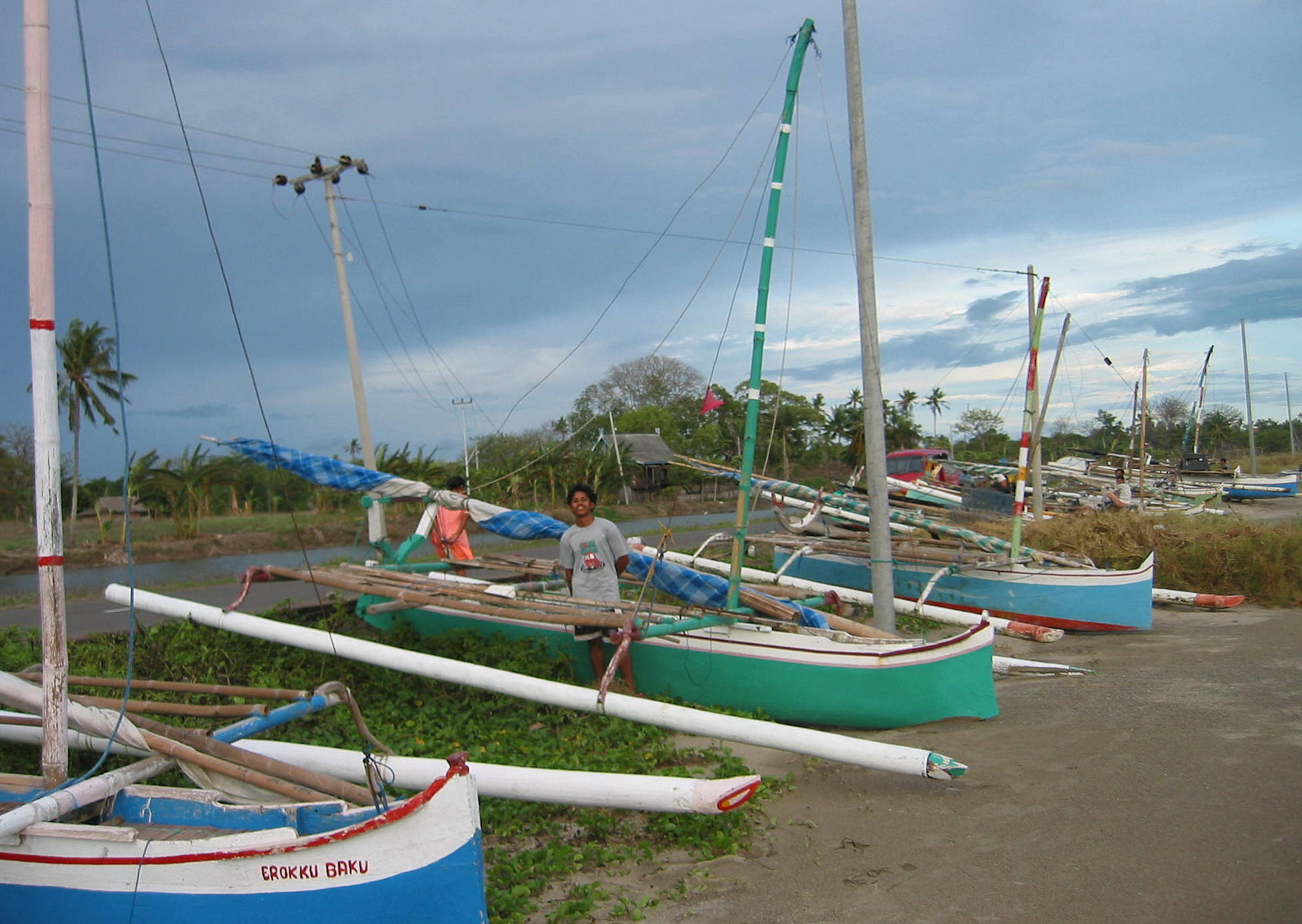 Sulawesi double outrigger fishing canoes. Thousands line the beaches 