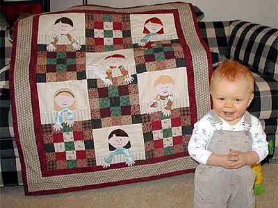 A picture of Trent and 
the quilt.