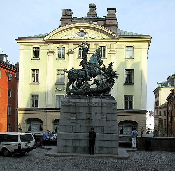 Alexis behind a statue of St. George and the dragon.