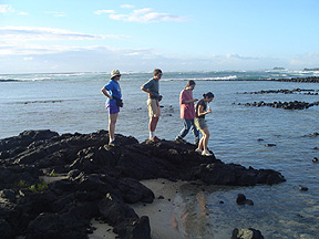 Climbing down to the nearshore at Kaloko to do a Hydrolab measurement. 