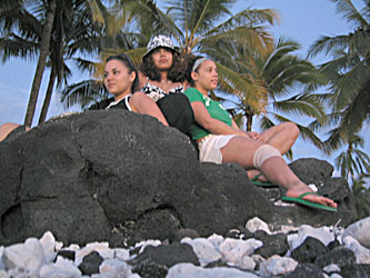 Veronica, Jazz, and Adrianna resting after a barbecue on the beach at Pu'uhonua o Honauhau National Historical Park. 
