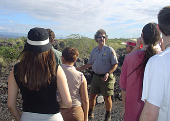 Stan Bonds, park archaeologist, points out Petroglyphs in Kaloko to our group. 