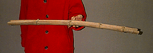 a piece of split bamboo is held in equilibrium in the air by one finger