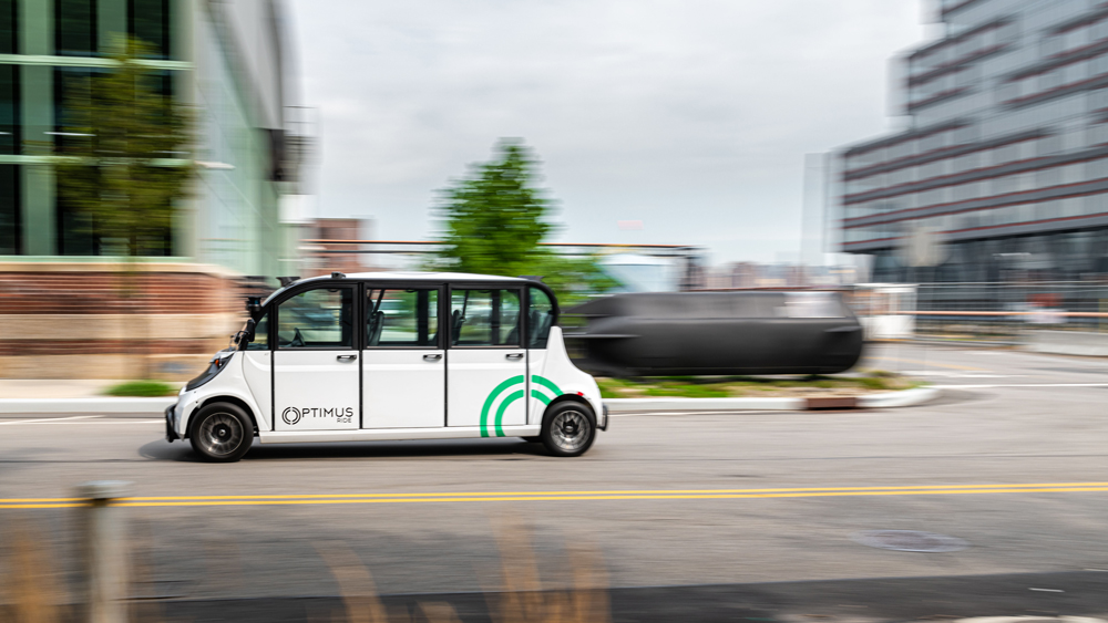 An Optimus driverless shuttle system operating on a road