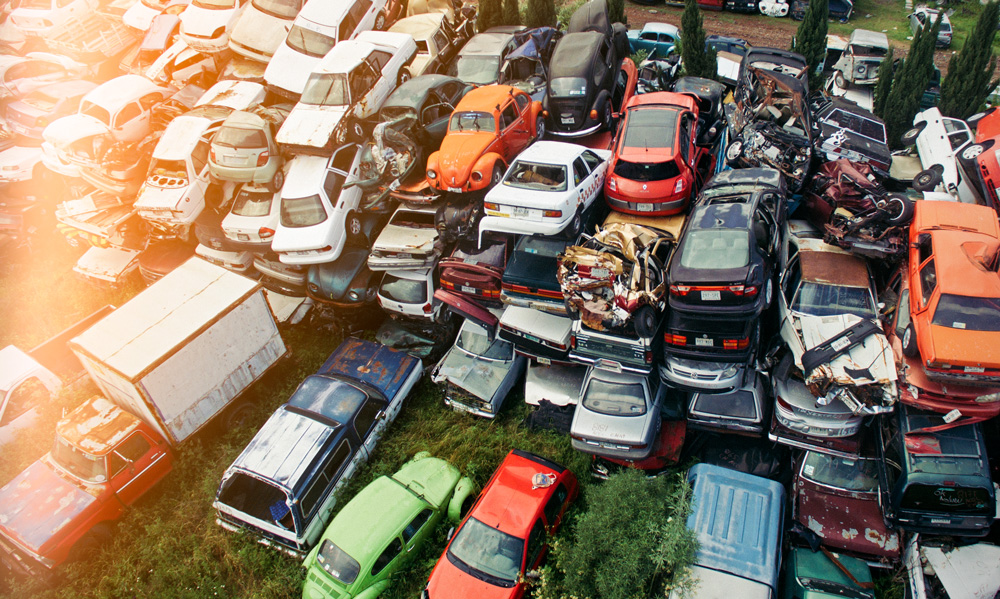 an aerial photo of a junkyard filled with many old cars