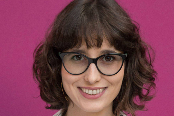 EMILIA SIMISON against a dark pink background