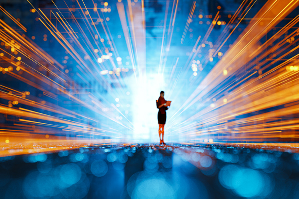 a figure standing in front of fiber optic lights