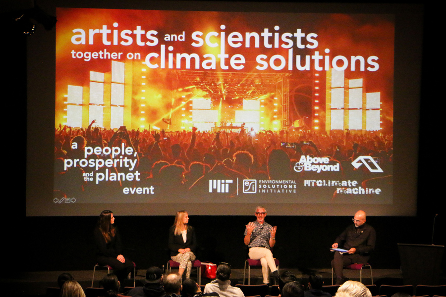 Four presenters on stage for The Artists and Scientists Together on Climate Solutions