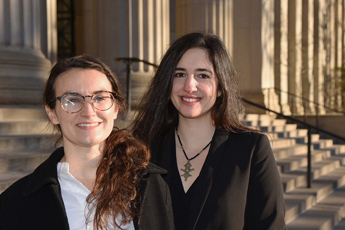 Courtney Lesoon and Elizabeth Yarina stand next to each other on campus
