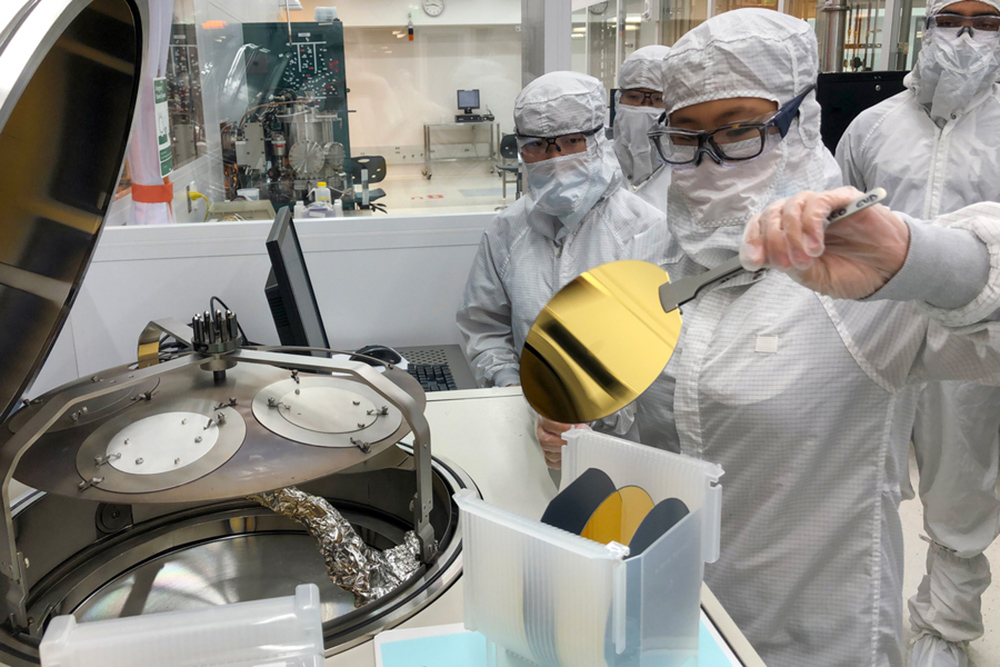 First-year undergraduate Audrey Lee loads an electron-beam evaporator with silicon wafers