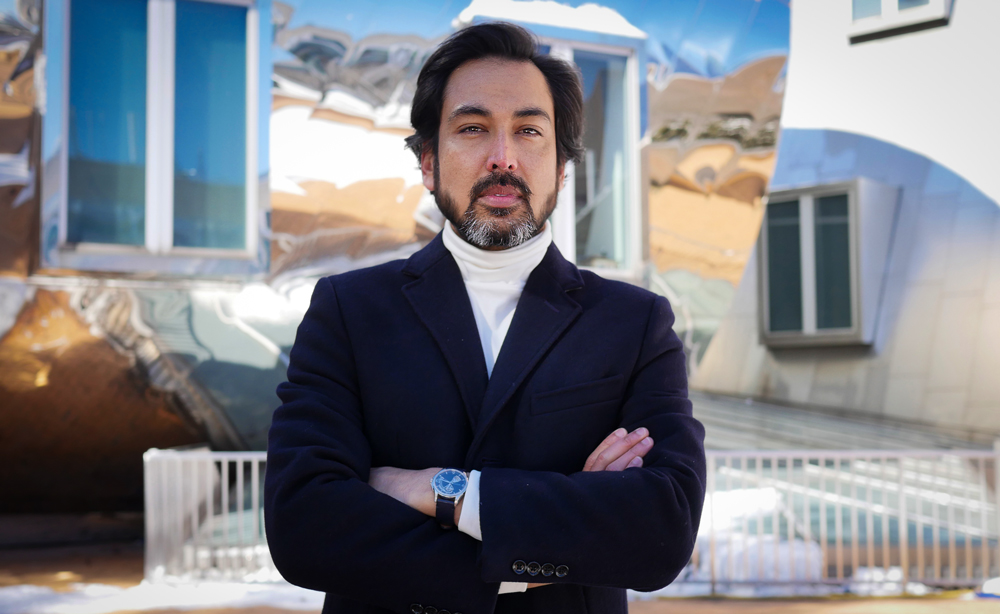 Photo of Postdoc Digbijay Mahat taken at Stata with reflective walls in background