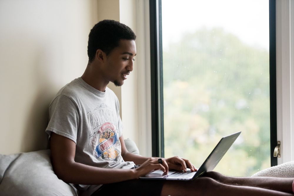 A student studies in his room.