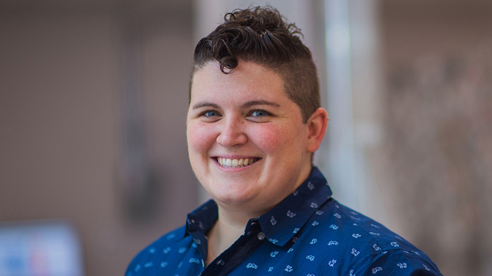 Portrait photo of Joy Dunn with blurry background