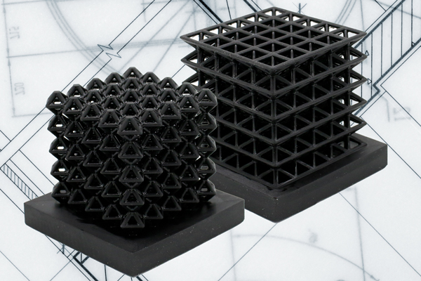 2 views of a flexible, black-square object that has air-filled channels that can deform 
