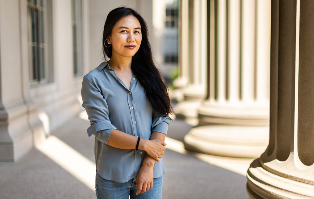 Photo of Danielle Li with MIT Killian Court columns in background