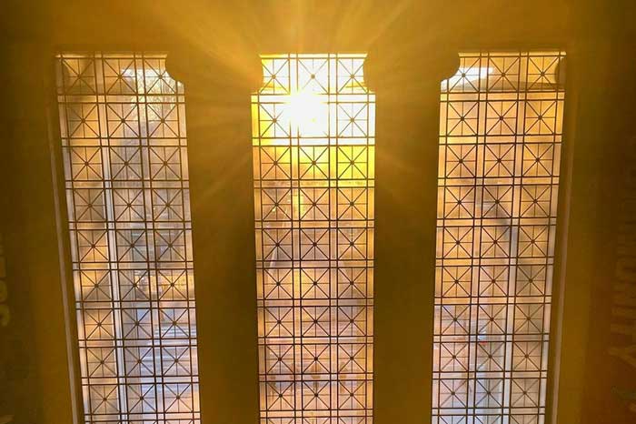 3 lobby 7 windows with sunlight streaming through