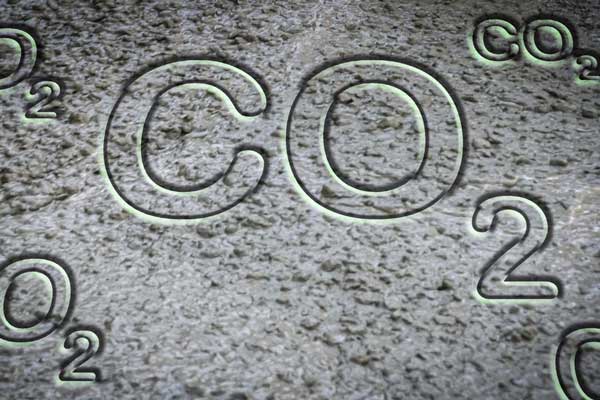 The letters "CO2" is embedded in wet cement concrete