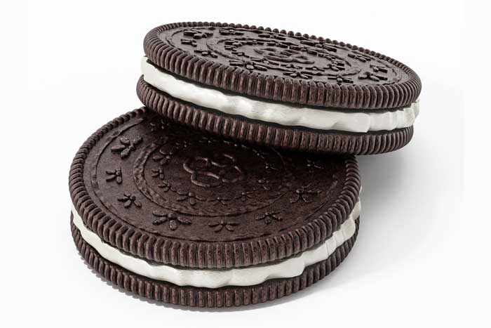 Closeup of 2 Oreo cookies on white background