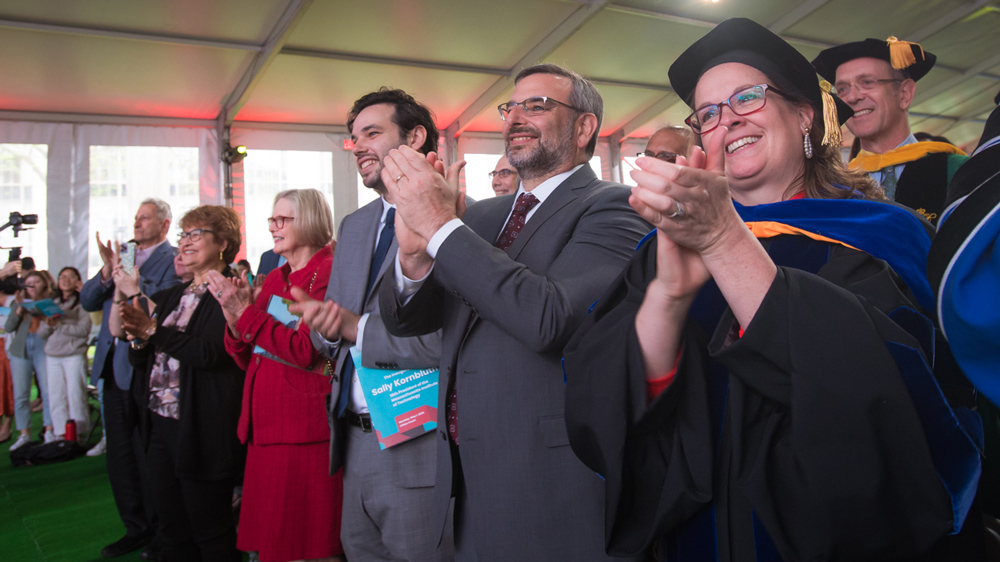 People in an audience applauding