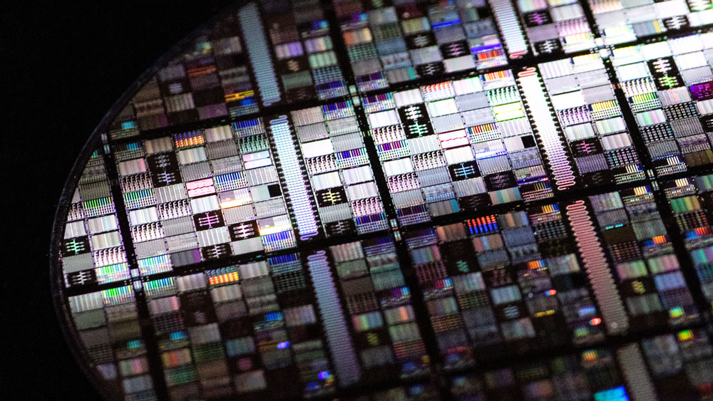 A close-up shot of a superconducting qubit wafer, showing microfabricated circuits