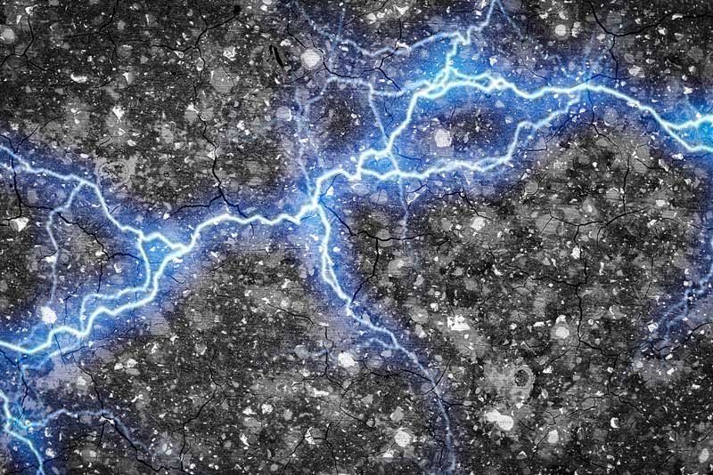 A streak of blue lightning, representing energy, spreads horizontally across a textured cement surface. 