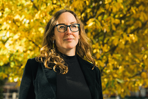 Megan Black portrait with yellow foliage in background