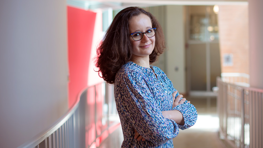 Isabel Naranjo De Candido stands inside Stata with arms crossed