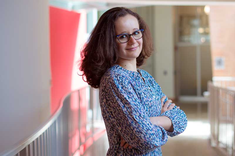 Isabel Naranjo De Candido stands inside Stata with arms crossed
