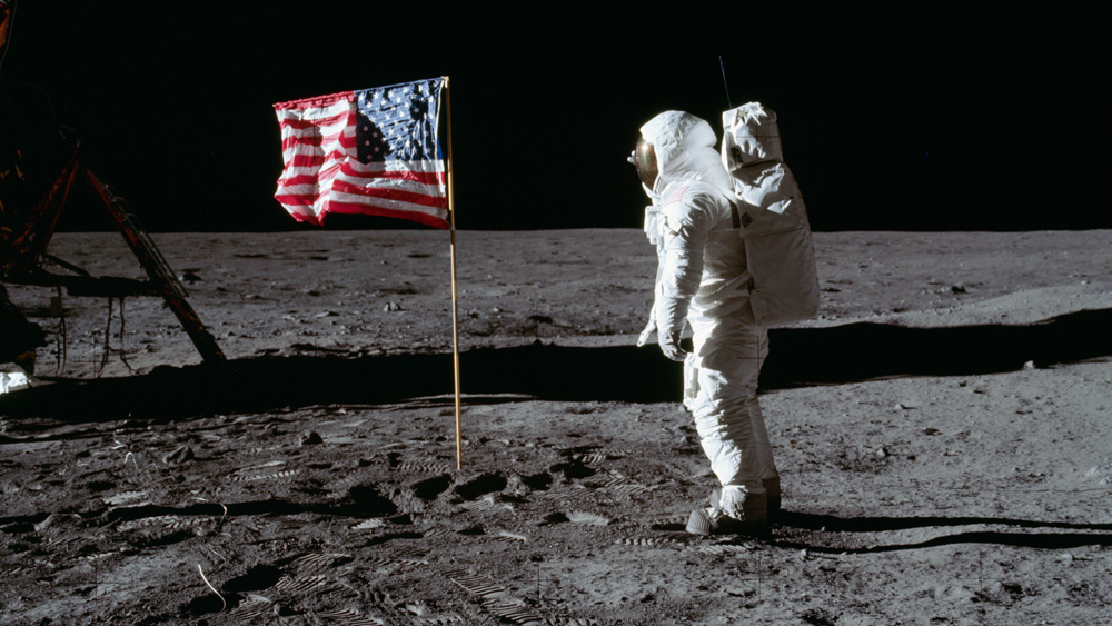 Buzz Aldrin on the moon's surface, with American flag