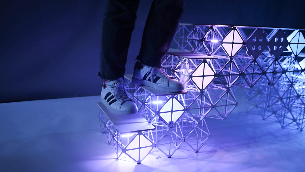 person stands on stairs made of modular materials
