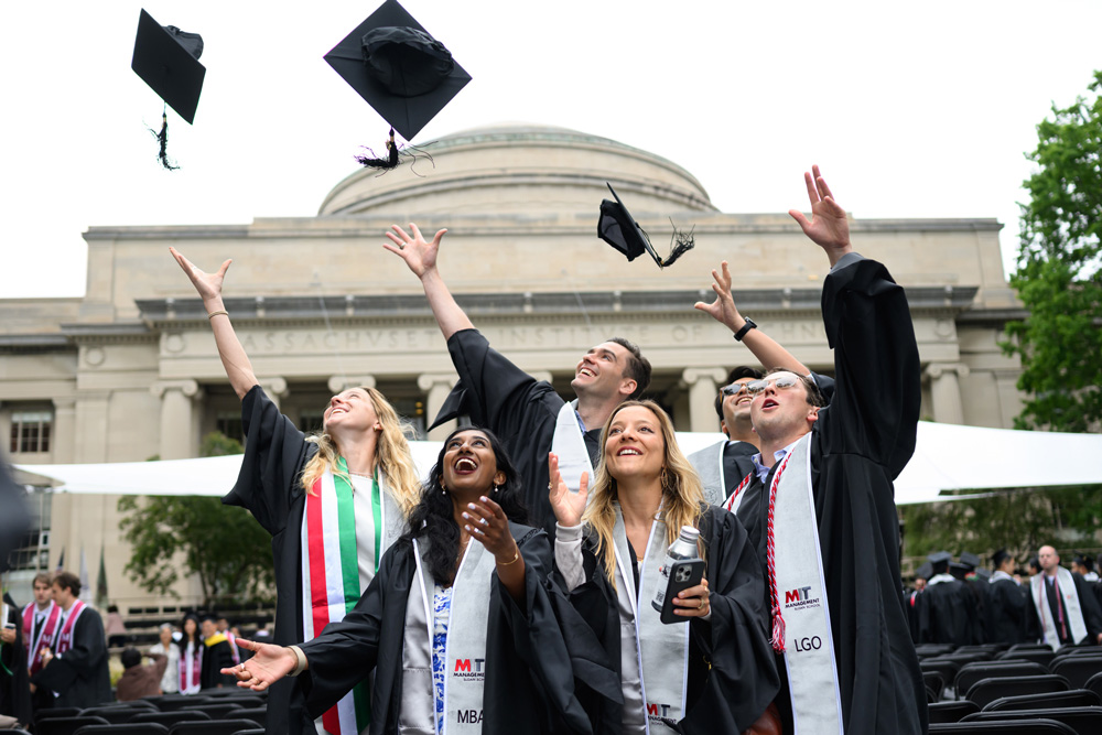 grads throw caps in the air