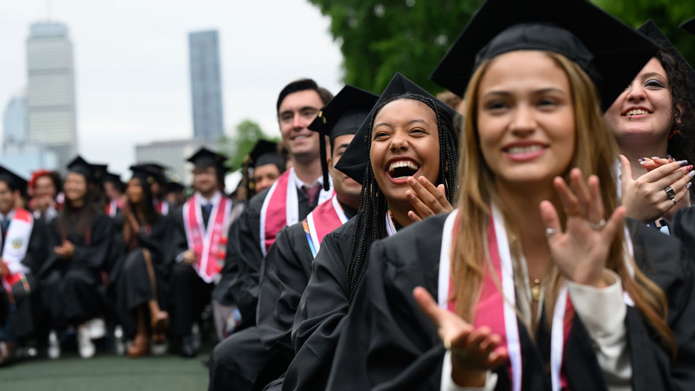 graduates happy and clapping