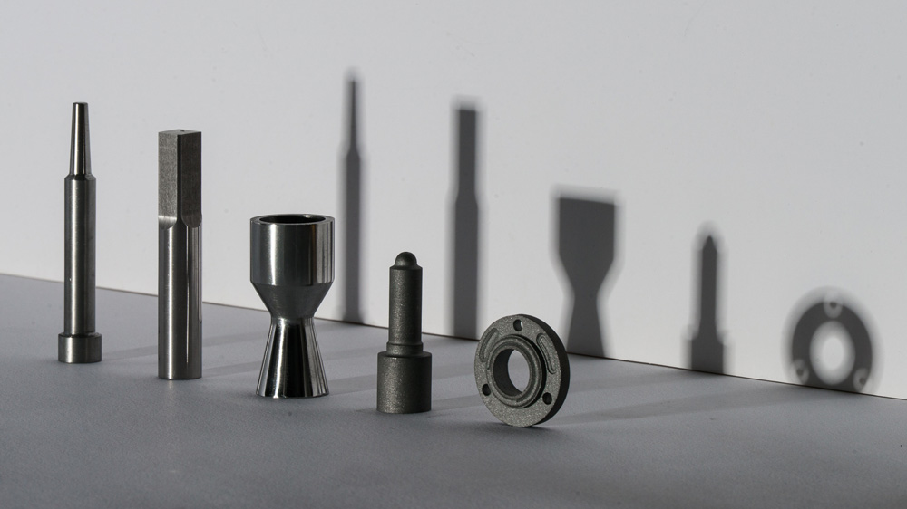 5 metal tool attachments, like a screwdriver