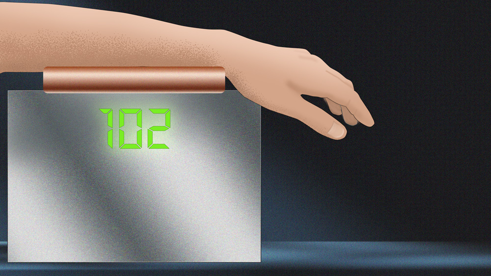 hand on machine to monitor glucose