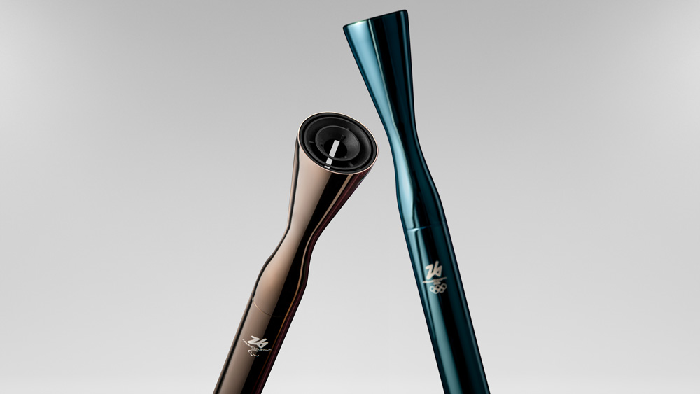 Two shiny, sleek Olympic torches in brown and teal.