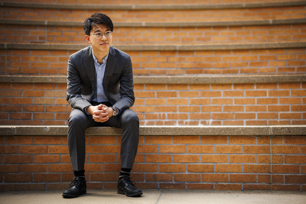 Naoki Egami sits in amphitheater near Stata
