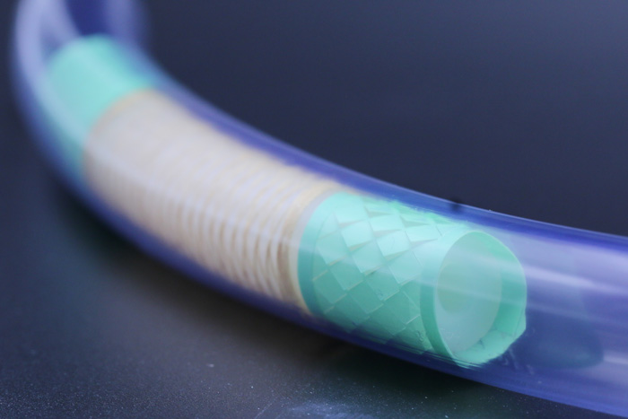 a small tube holding the small intestinal robot