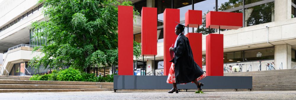 MIT student walking on graduation day