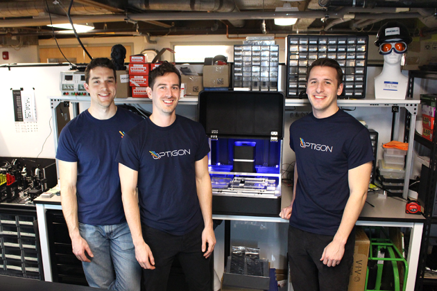 Optigon co-founders (from left to right) Brandon Motes, Dane deQuilettes, and Anthony Troupe stand with a benchtop version of the measurement tool they believe will help accelerate the pace of solar power and other clean energy products. 