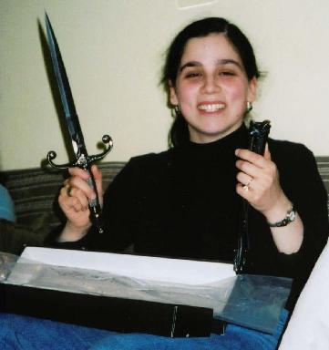 [Yevgeniya smiling at her new dagger, one of the presents]