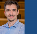 Portrait photo of Alexander (Sasha) Rakhlin with solid background color