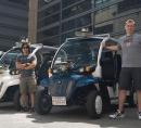 Photo of electric vehicle and two reserchers